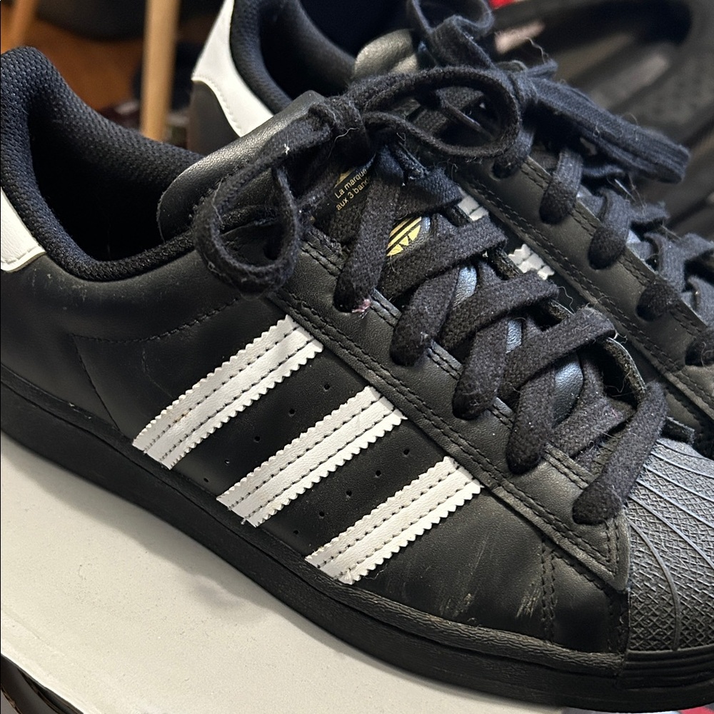 Adidas Classic Black Sneakers with White Stripes